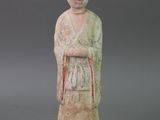 statue of a woman in a kimono dress with a red ribbon around her waist