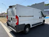 a white van that is parked on the side of the road