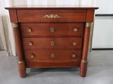 an image of a wooden chest of drawers with a marble top