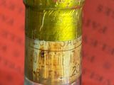 a close up of a bottle of wine on a table