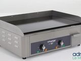 a close up of an electric griddle on a white surface