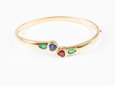 Bracelet jonc ouvrant en or jaune, section ovale, orné d'un …