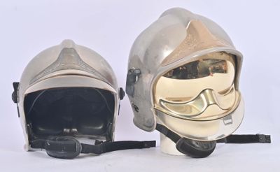 two helmets that are sitting next to each other on a white surface