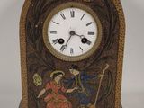 a wooden clock with a painting on it