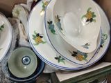 a box full of dishes and cups and saucers