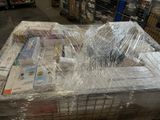 a large pile of books wrapped in plastic on a pallet