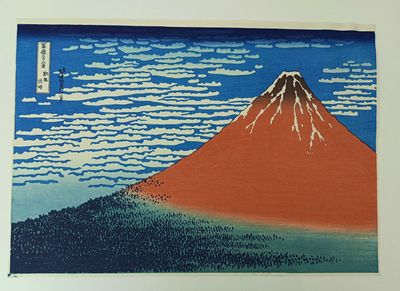 a picture of a painting of a mountain with clouds in the sky