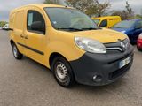 yellow van parked in a parking lot with other cars in the background