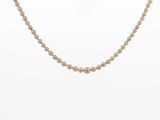 a gold beaded necklace on a mannequin mannequin mannequin mannequin mannequin mannequin mannequin mannequin mann