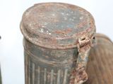 a close up of a metal container with a rusted lid