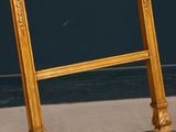 a picture of a gold frame on a chair