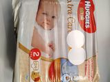 a bag of diapers with a picture of a baby on it