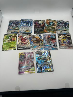 a lot of pokemon cards in a box on the table