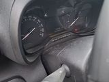 a car dashboard with a dash light and gauges