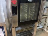 a commercial oven that is sitting in the middle of a kitchen