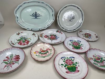 a lot of plates that are sitting on a table