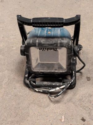 an image of a small portable power washer on the ground
