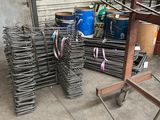 a pile of steel rods stacked on top of each other in a warehouse