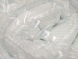 a baby in a plastic bag that is wrapped in plastic