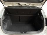 a trunk of a white car with its doors open