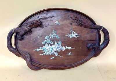a wooden tray with a bird and flowers on it