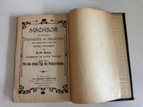 a book opened on a white table with a black border