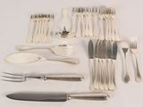 a lot of silverware on the table and silverware on the table