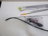 a bow and arrow laying on a table next to a pair of scissors