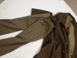 a pair of pants and a jacket laying on a table