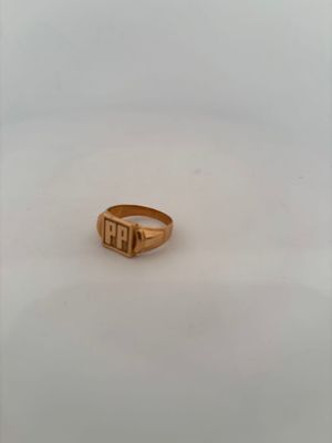 an image of a gold ring with the word person engraved on it