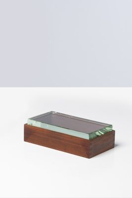 wooden and glass box with a glass top on a white surface