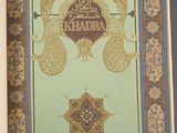 an open book with a picture of a peacock on it
