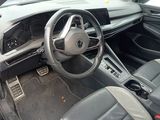the interior of a car with a steering wheel and a dashboard