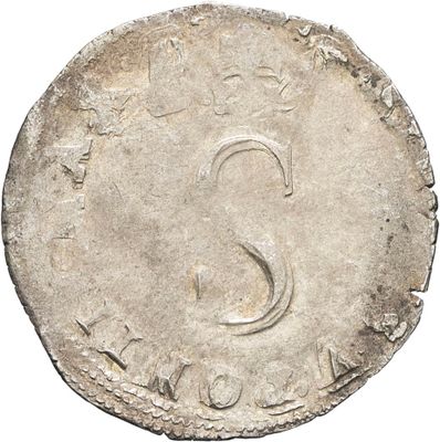 a close up of a coin with the letter s on it