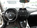 a car dashboard with a steering wheel and a phone holder in it