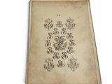 an old book with a drawing of letters and symbols on it