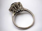 a close up view of a ring with a black diamond in it