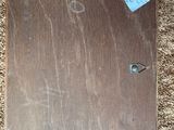 a picture of a piece of wood with a tag on it