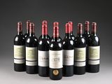 six bottles of red wine lined up in a row