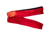 pair of red and black pants on a white background