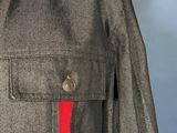 a close up of a shirt with a red tie on a mannequin mannequin mannequin mannequin mannequin mannequin manne