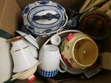 a cardboard box filled with many different types of items