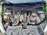 the engine of a car with its hood open and the hood down