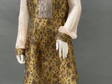 an image of a mannequin wearing a yellow and black dress