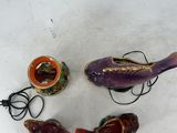 three fish figurines on a white table