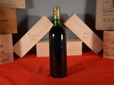 a bottle of wine that is sitting on a table