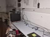 a white desk with a laptop on it and a chair in front of it