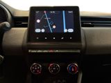 the dashboard of a car with a gps device on the dashboard