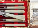 a box with a set of knives and knives in it