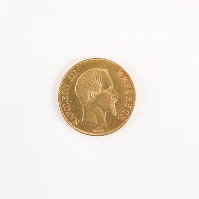 une pièce d'or sur laquelle est représentée la tête d'un homme